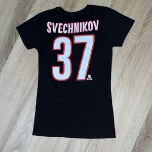 NWOT Girl Carolina Hurricanes 37 Andrei Svechnikov Black Flags Logo Jersey shirt
